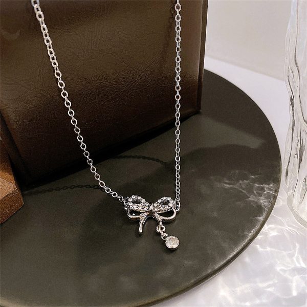 Cubic Zirconia & Silver-Plated Bow Pendant Necklace For Discount